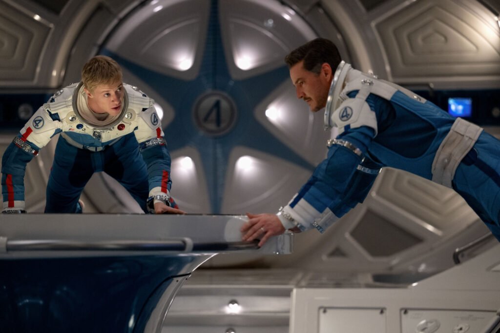 Johnny and Reed floating in their spaceship