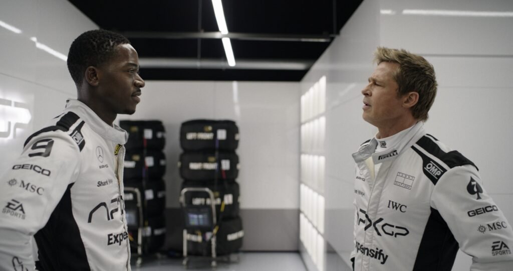 DAMSON IDRIS as Joshua Pearce and BRAD PITT as Sonny Hayes.
